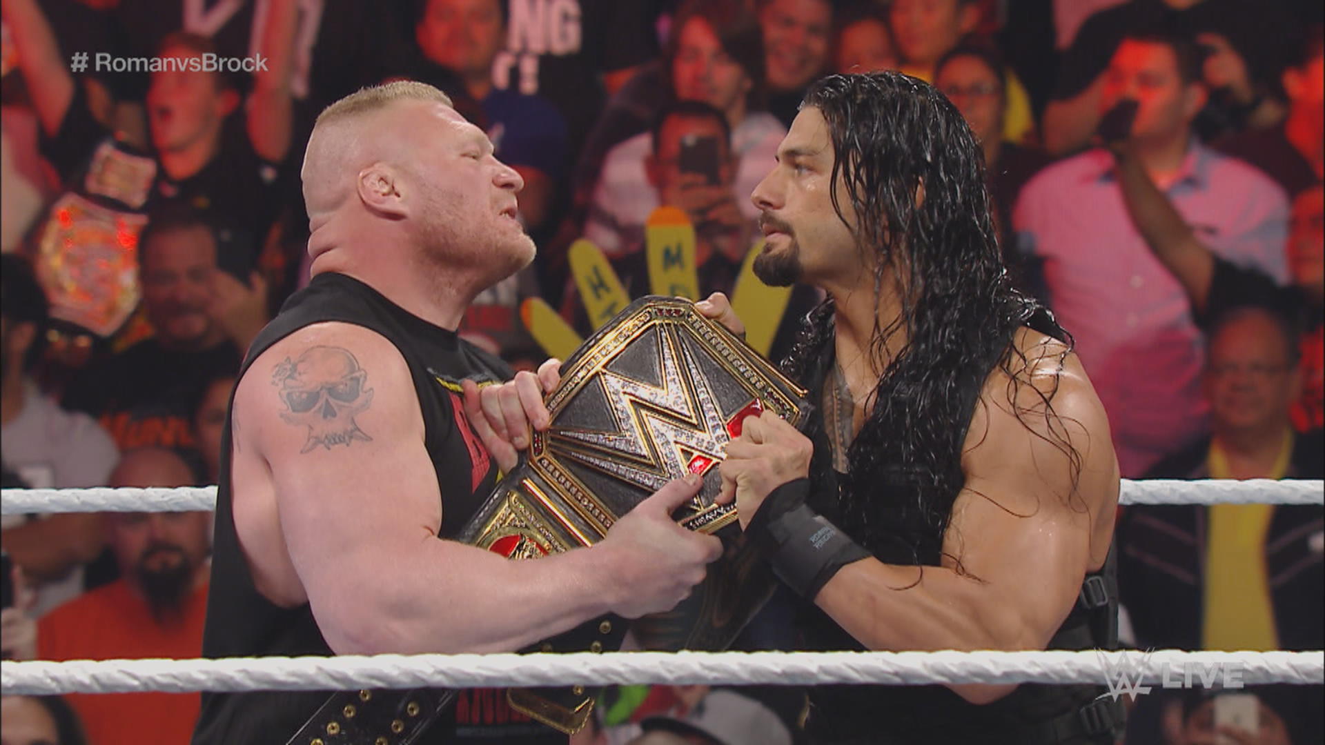 WWE Brock Lesnar and Roman Reigns tug of war 