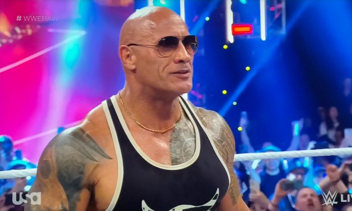 The Rock Returns On WWE Day 1 Raw, Teases Match With Roman Reigns
